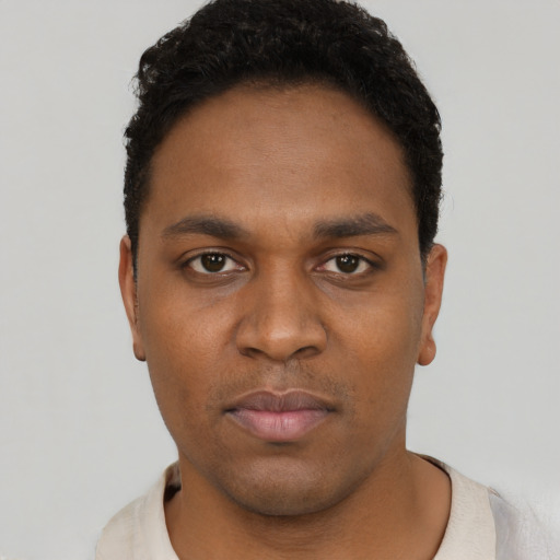Neutral black young-adult male with short  black hair and brown eyes