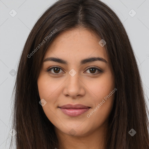 Joyful latino young-adult female with long  brown hair and brown eyes