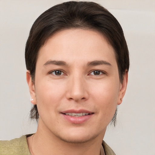 Joyful white young-adult female with short  brown hair and brown eyes