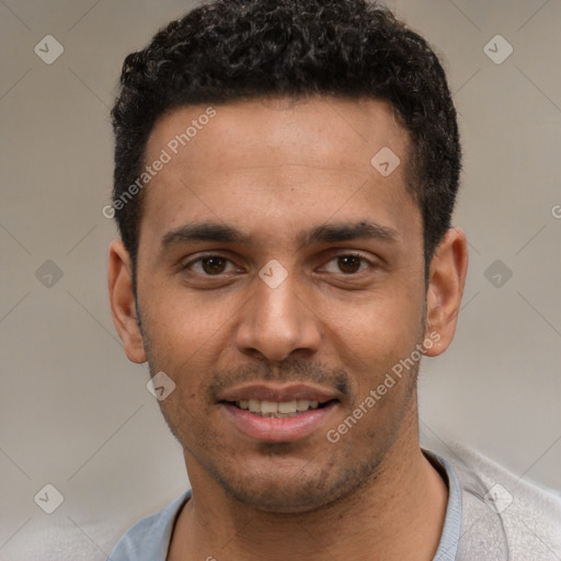 Joyful white young-adult male with short  black hair and brown eyes