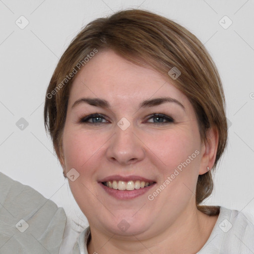 Joyful white young-adult female with medium  brown hair and blue eyes