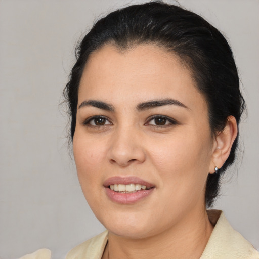 Joyful latino young-adult female with medium  black hair and brown eyes