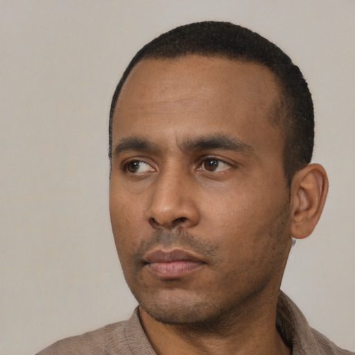 Neutral black young-adult male with short  black hair and brown eyes