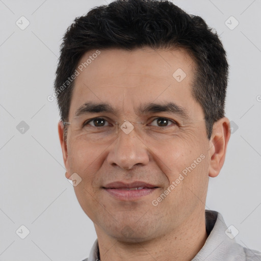 Joyful white adult male with short  black hair and brown eyes