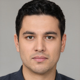 Neutral white young-adult male with short  black hair and brown eyes