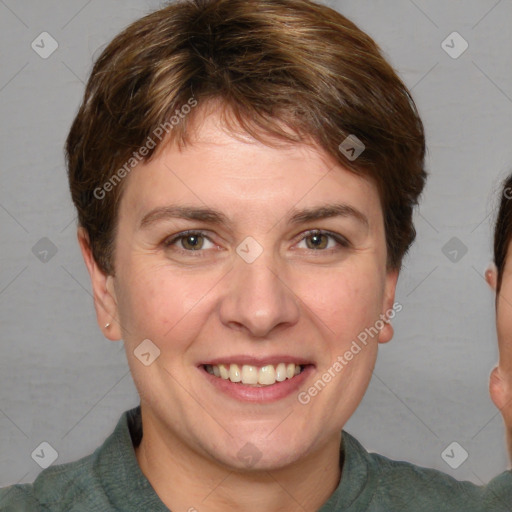 Joyful white adult female with short  brown hair and grey eyes