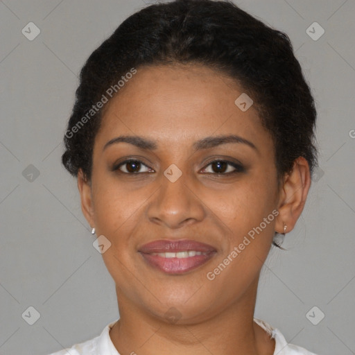 Joyful black young-adult female with short  brown hair and brown eyes