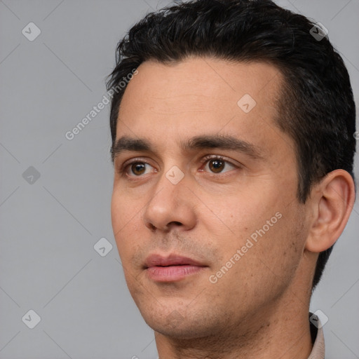 Neutral white young-adult male with short  black hair and brown eyes