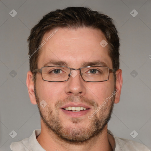 Joyful white adult male with short  brown hair and brown eyes