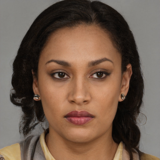 Neutral black young-adult female with medium  brown hair and brown eyes