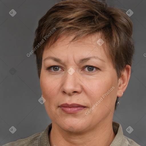 Joyful white adult female with short  brown hair and grey eyes