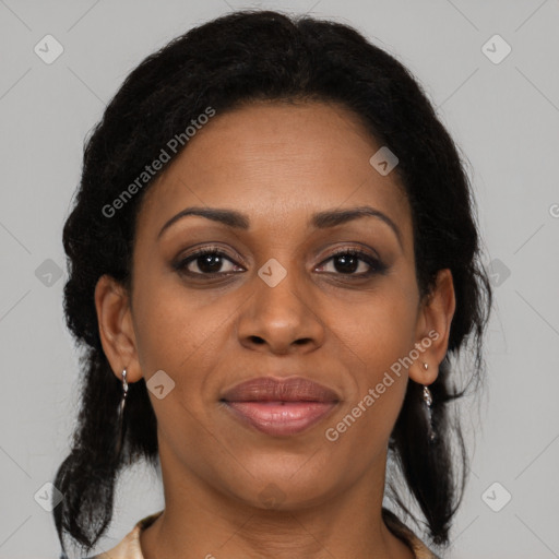 Joyful black adult female with medium  brown hair and brown eyes