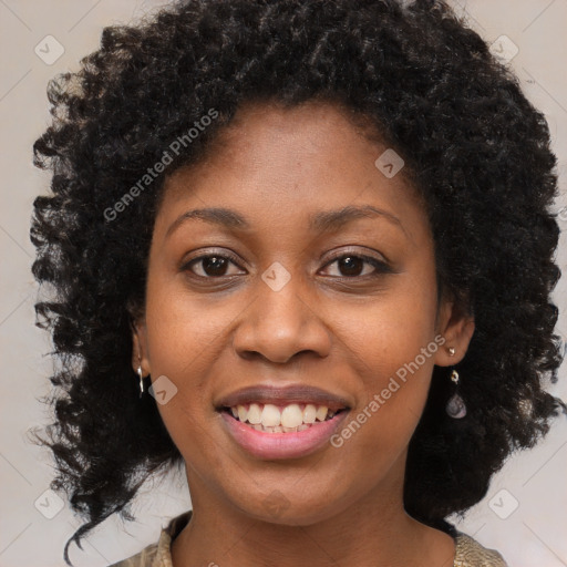 Joyful black young-adult female with medium  brown hair and brown eyes