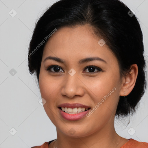 Joyful latino young-adult female with medium  brown hair and brown eyes