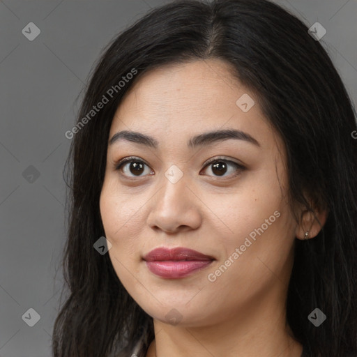 Joyful asian young-adult female with long  brown hair and brown eyes