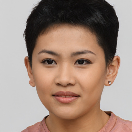 Joyful asian young-adult female with short  brown hair and brown eyes