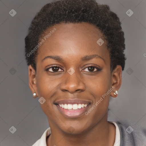 Joyful black young-adult female with short  brown hair and brown eyes