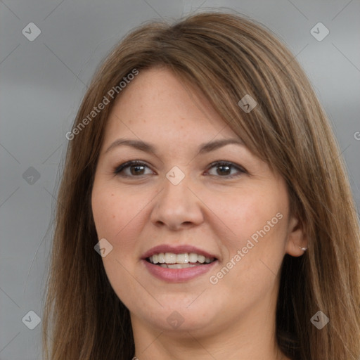 Joyful white adult female with long  brown hair and brown eyes