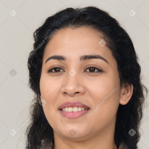 Joyful latino young-adult female with long  brown hair and brown eyes