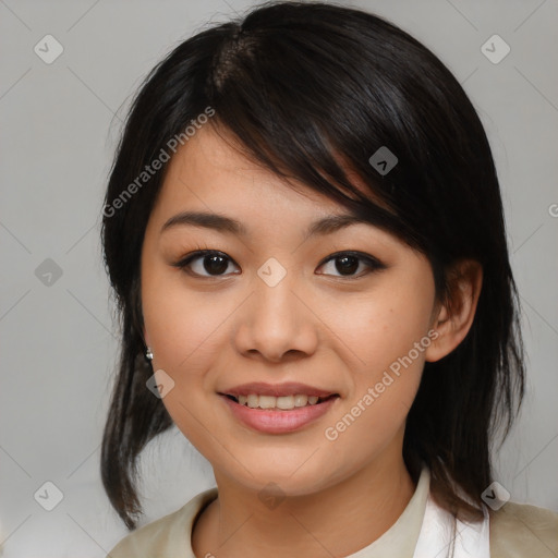 Joyful asian young-adult female with medium  black hair and brown eyes