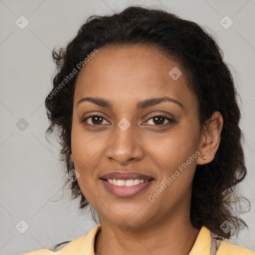 Joyful black young-adult female with medium  brown hair and brown eyes