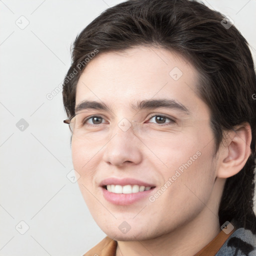 Joyful white young-adult male with medium  brown hair and brown eyes