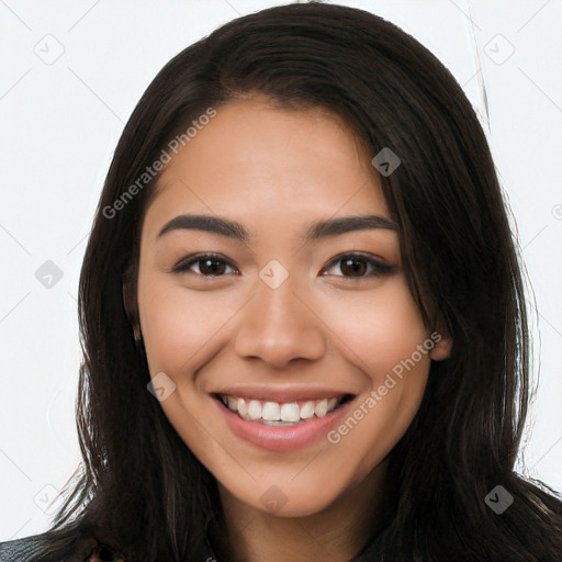 Joyful latino young-adult female with long  brown hair and brown eyes