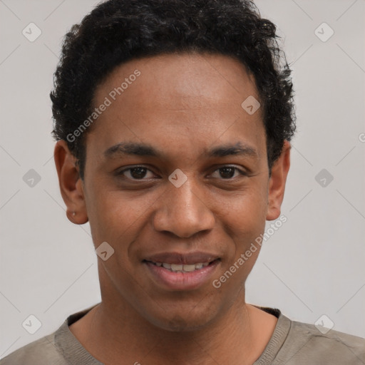 Joyful black young-adult male with short  brown hair and brown eyes