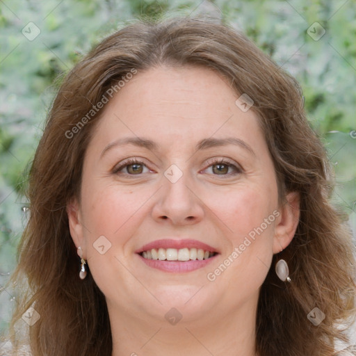 Joyful white adult female with long  brown hair and grey eyes