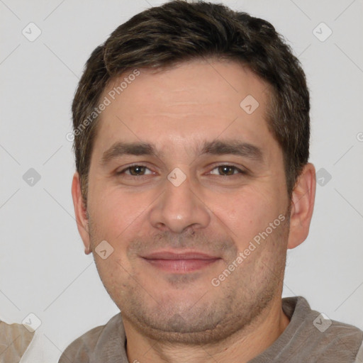 Joyful white adult male with short  brown hair and brown eyes