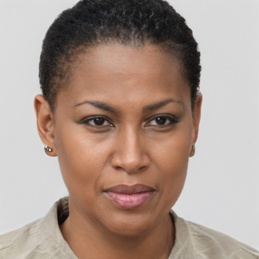 Joyful black young-adult female with short  brown hair and brown eyes