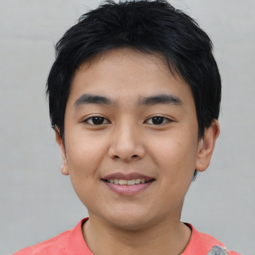 Joyful asian young-adult male with short  black hair and brown eyes