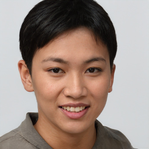 Joyful asian young-adult female with short  brown hair and brown eyes