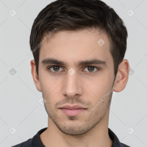 Neutral white young-adult male with short  brown hair and brown eyes