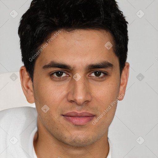 Joyful white young-adult male with short  black hair and brown eyes