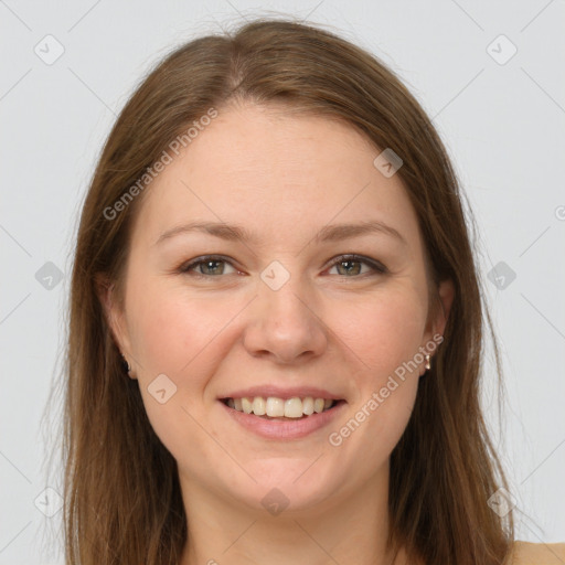 Joyful white young-adult female with long  brown hair and grey eyes