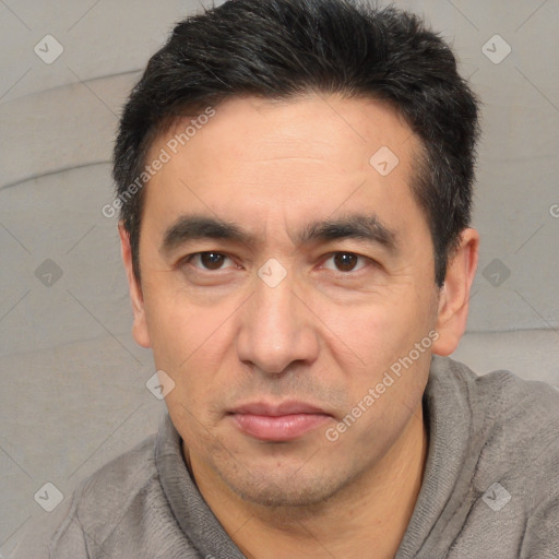 Joyful white adult male with short  black hair and brown eyes