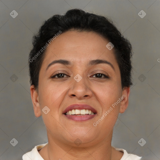 Joyful latino adult female with short  brown hair and brown eyes