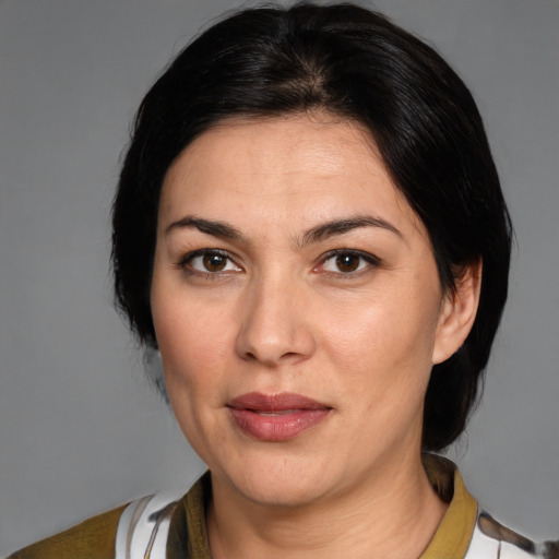 Joyful white adult female with medium  brown hair and brown eyes