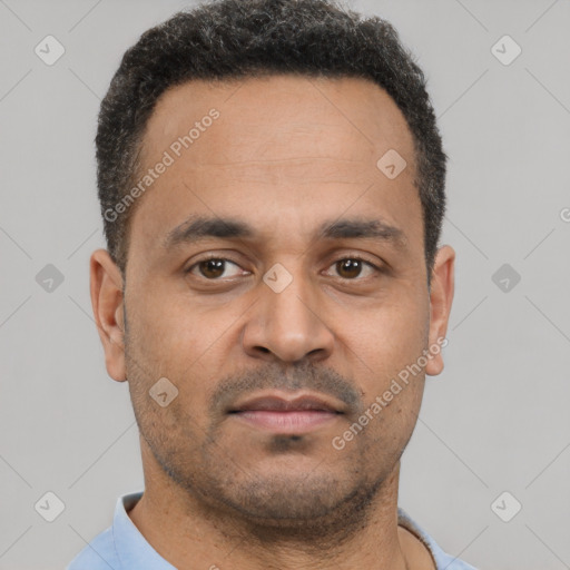 Neutral latino young-adult male with short  black hair and brown eyes