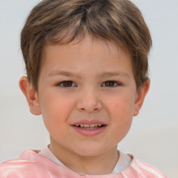 Joyful white child male with short  brown hair and brown eyes