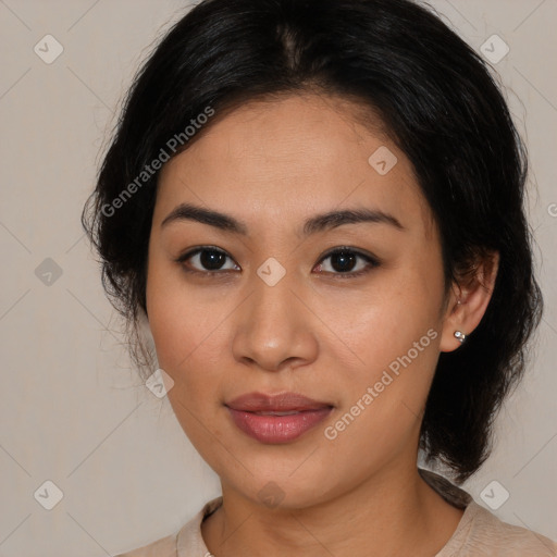 Joyful latino young-adult female with medium  brown hair and brown eyes