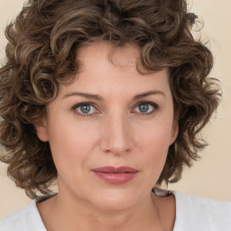 Joyful white young-adult female with medium  brown hair and green eyes