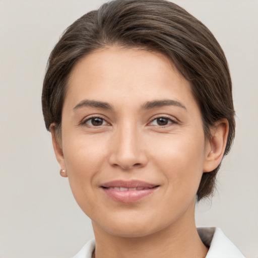 Joyful white young-adult female with medium  brown hair and brown eyes