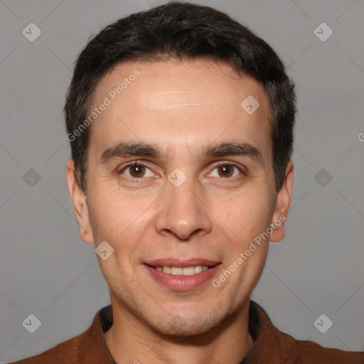 Joyful white adult male with short  brown hair and brown eyes