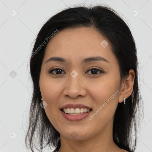 Joyful asian young-adult female with long  brown hair and brown eyes