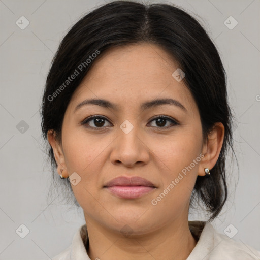 Joyful latino young-adult female with medium  brown hair and brown eyes