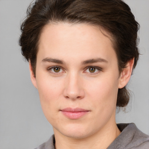 Neutral white young-adult female with short  brown hair and brown eyes