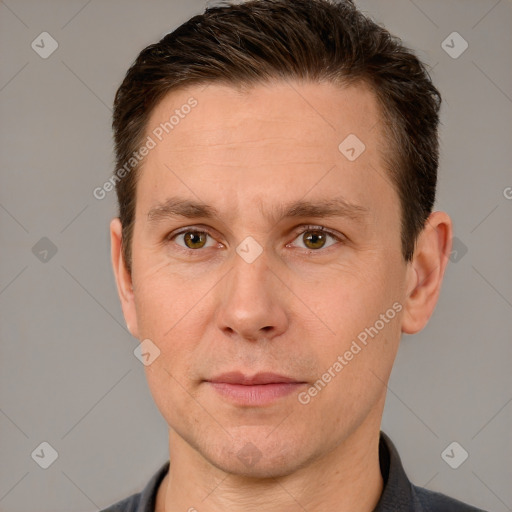 Joyful white adult male with short  brown hair and brown eyes