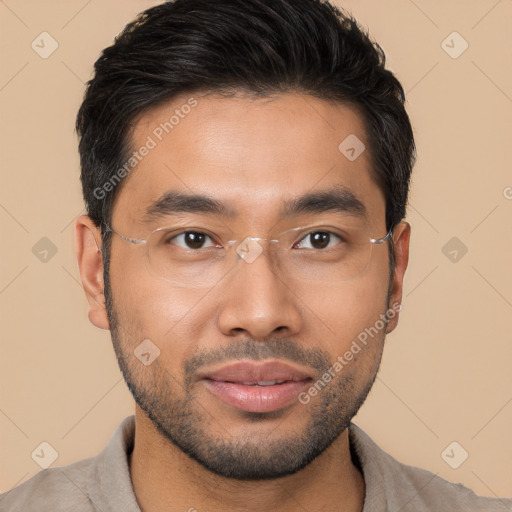 Joyful latino young-adult male with short  brown hair and brown eyes